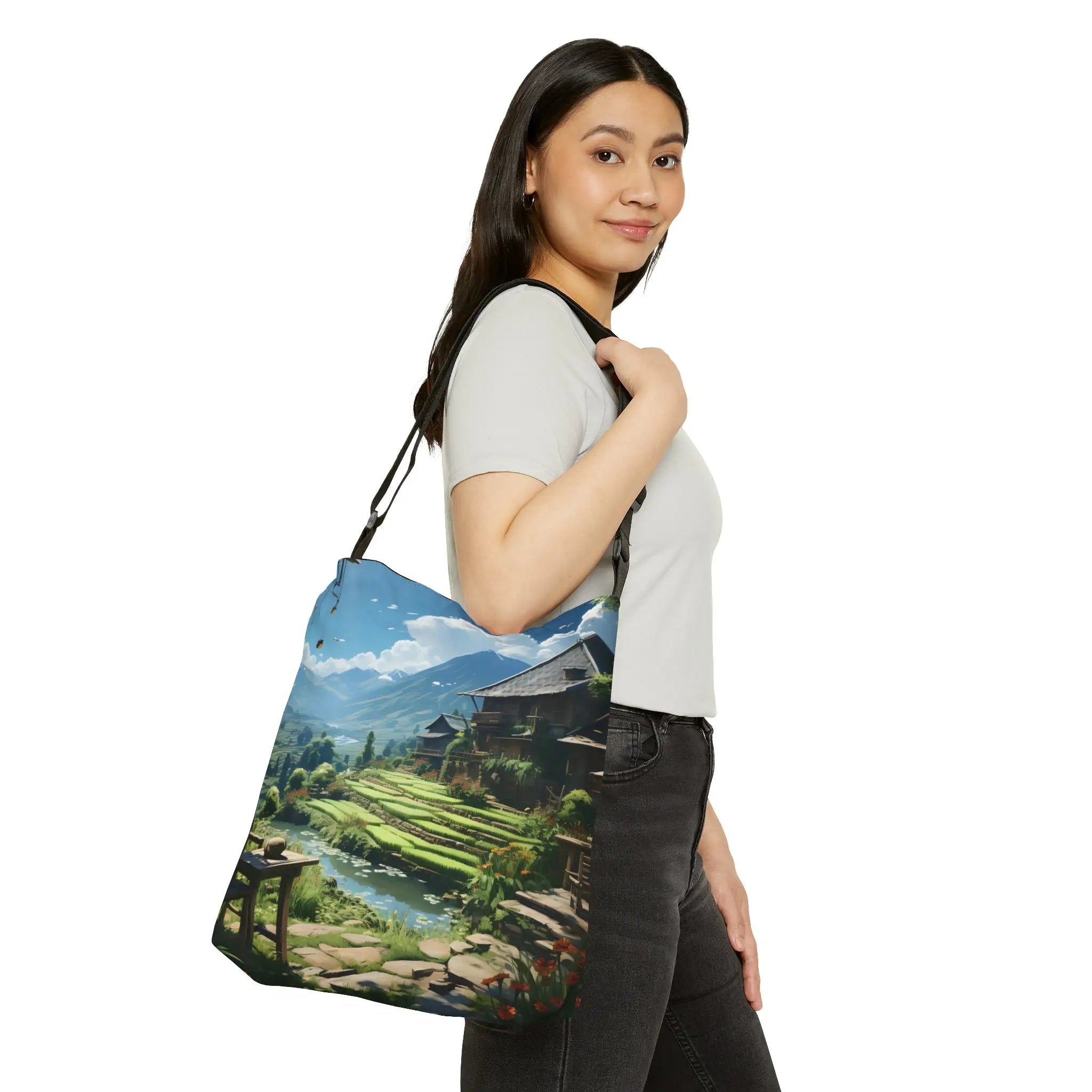 Weekender tote bag | a woman carrying a bag with a painting on it