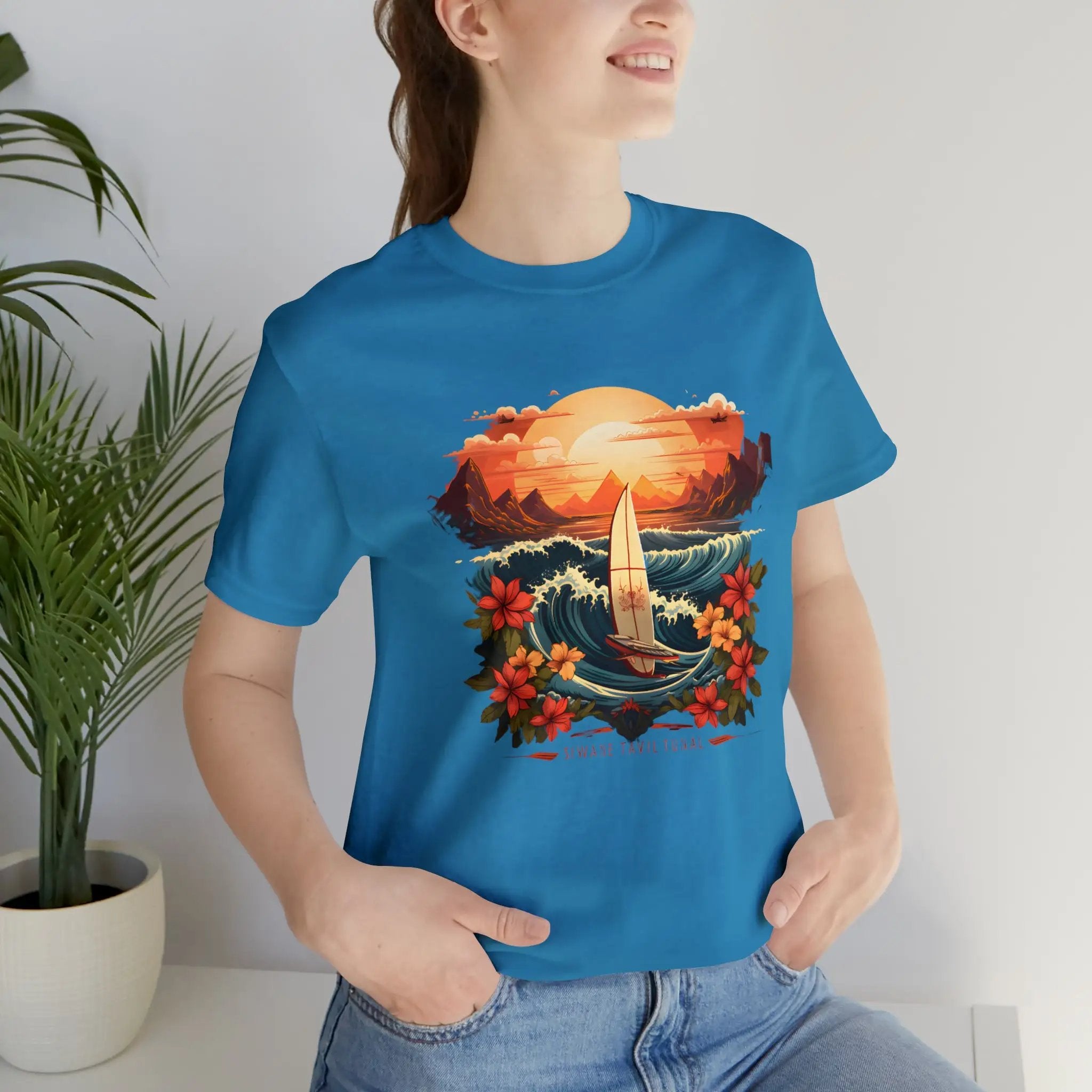 Couple t shirt | a woman wearing a blue t - shirt with a picture of a sailboat on