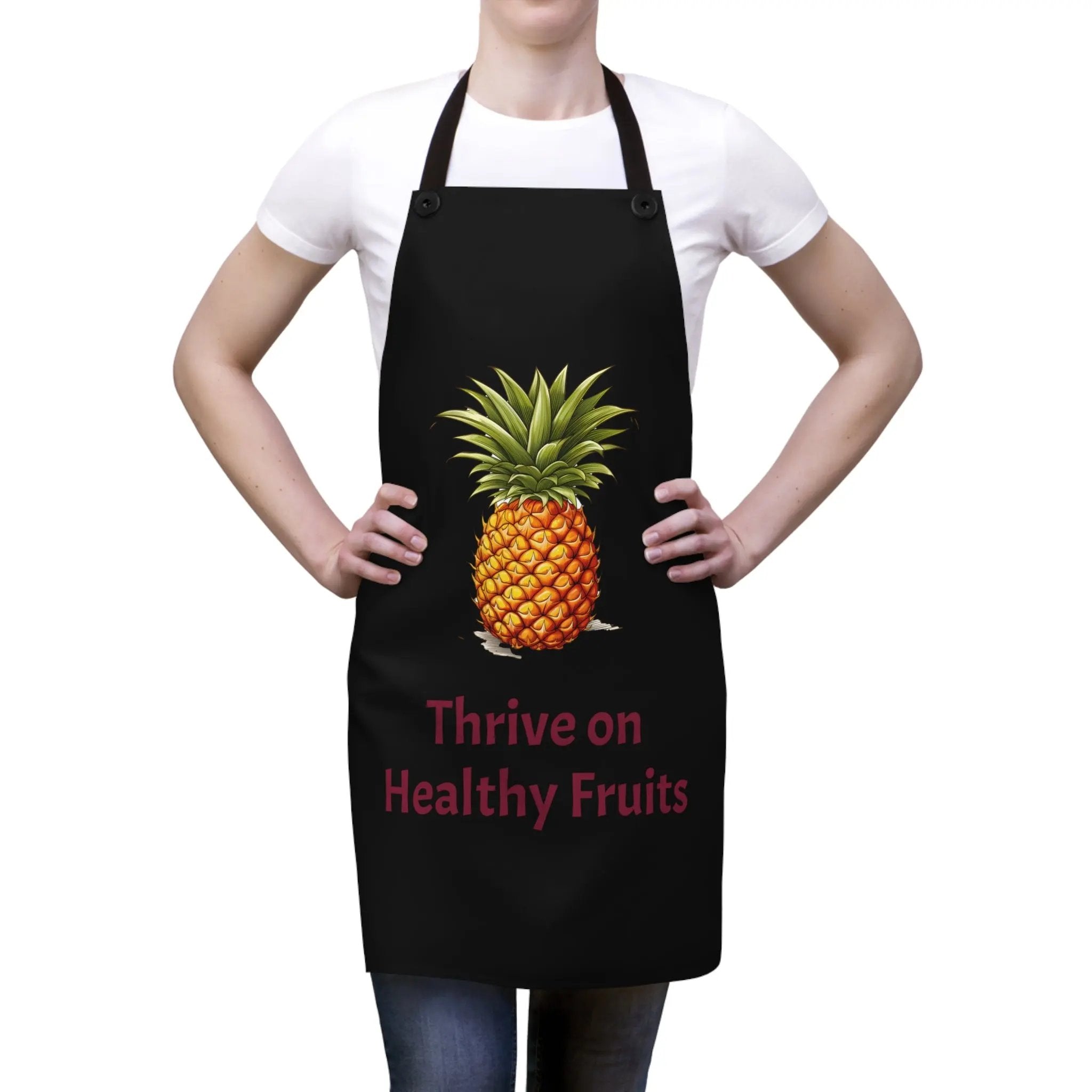 Chef Apron | a woman wearing a black apron with a pineapple on it