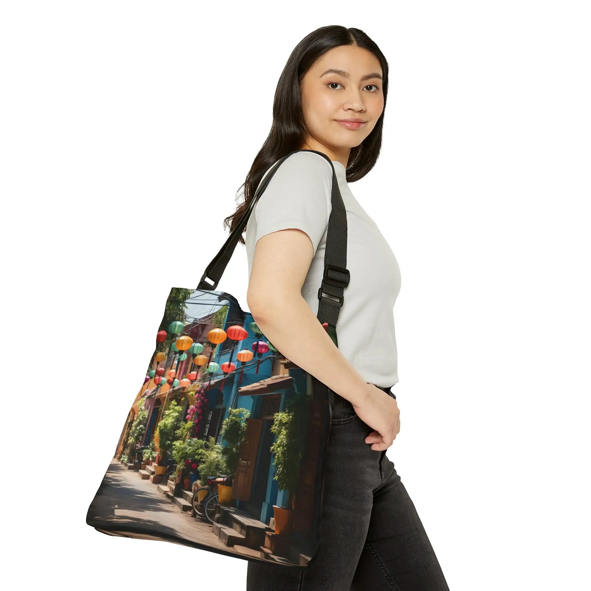 Weekender tote bag | a woman carrying a bag with a picture of a street