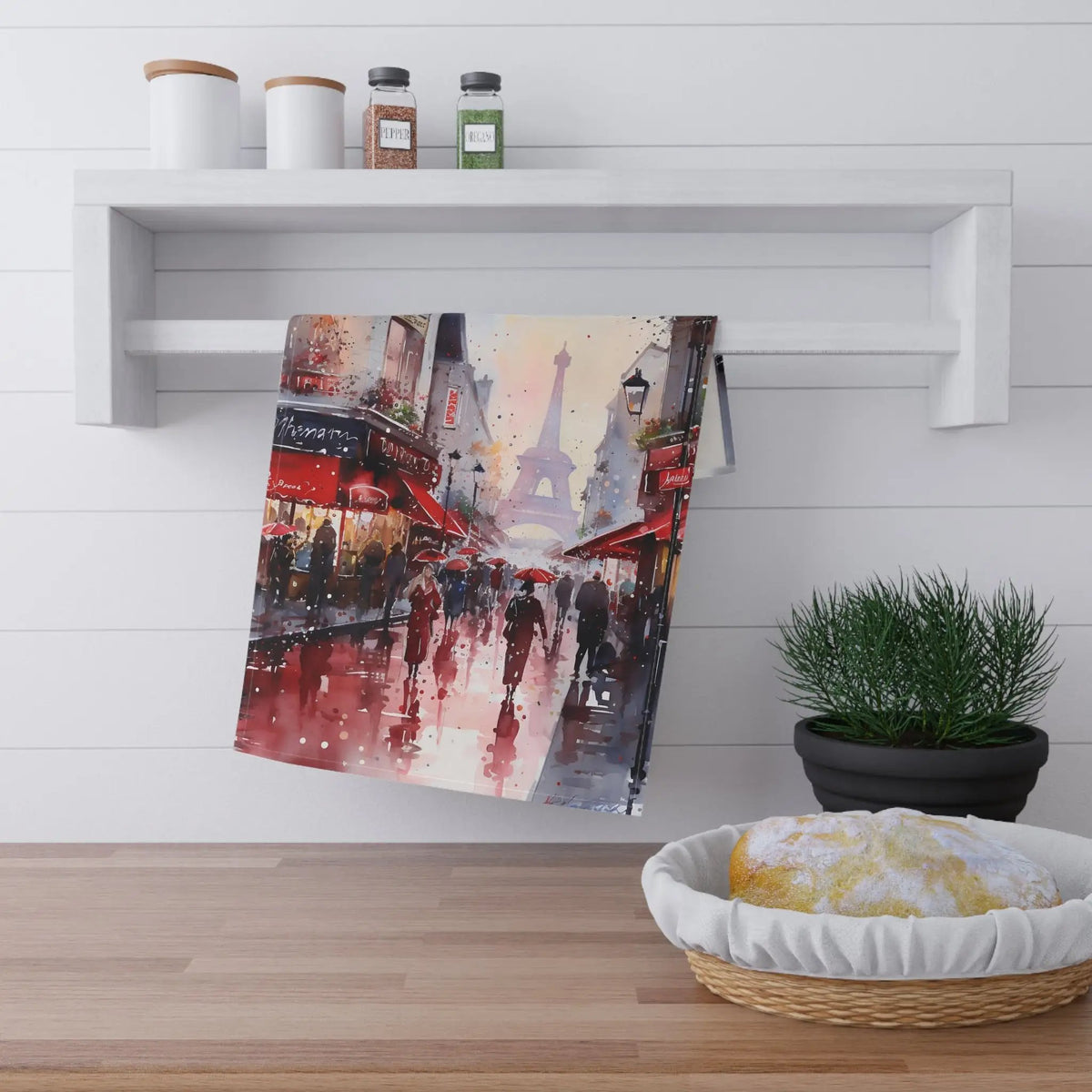 Kitchen Towel | a painting hanging on a wall next to a potted plant