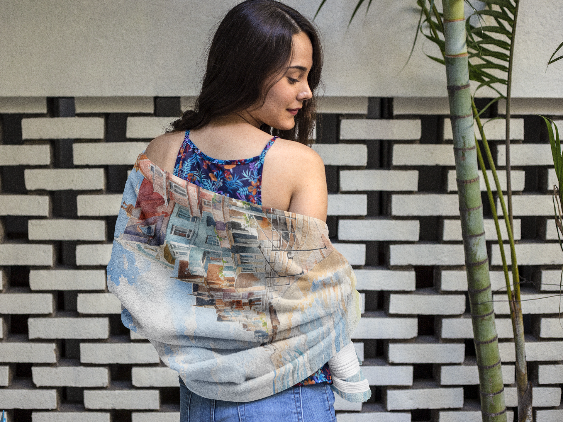 Best bath towel | a woman wearing a blue and white top and jeans